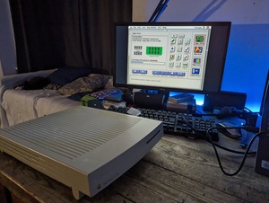 LC III running the Snooper 2.0 diagnostic utility on System 7.5. The computer is shown here running the RAM test of the utility; testing both the internal and external RAM installed with different binary patterns in sequence. This is visualised with an illustration of internal RAM chips and an Expansion SIMM. 