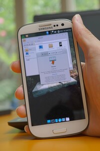 Galaxy S3 running postmarketOS v22.12.2 with its custom config of the Xfce desktop environment. A Thunar file manager window is open with the about screen as well, which shows it has Thunar version 4.16.11 installed, along with a description that reads "Thunar is a fast and easy to use file manager for the Xfce desktop Environment".